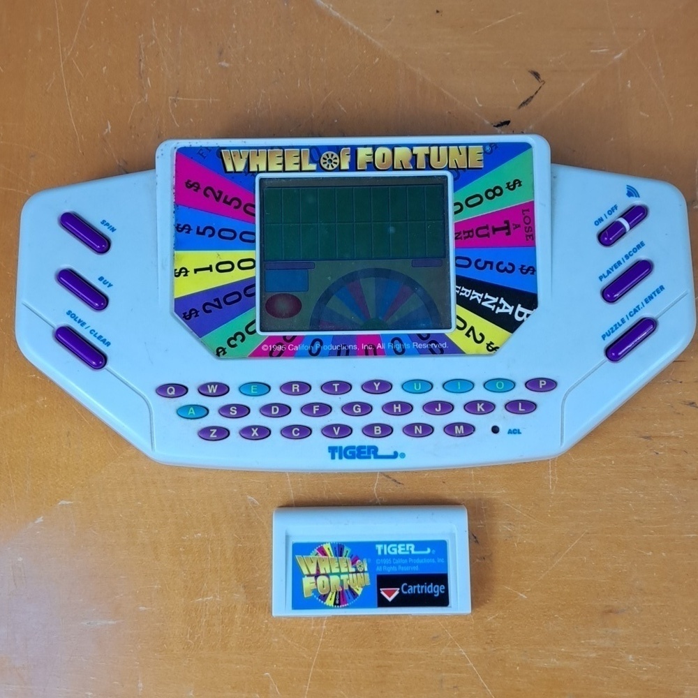 Vintage 1999 Tiger Wheel of Fortune hand held electronic game show game Tested